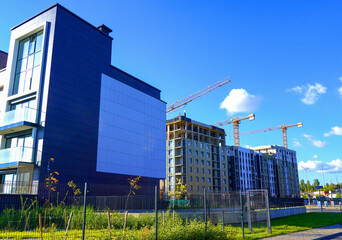 Tower Crane on building construction. Construction crane on Housing. Construction site, Multi Storey Residential Buildings construction. Formworks. Modern Townhome building. Modern House building.