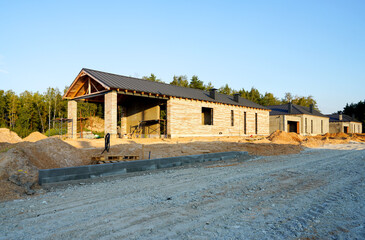 Villa construction. Prefab house under construction. Suburban house Construction. Prefabricated...