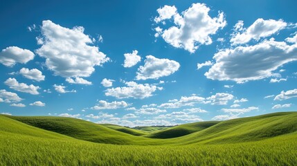 Obraz premium Rolling hills covered in green grass, beneath a clear blue sky with scattered white clouds. Peaceful and natural.