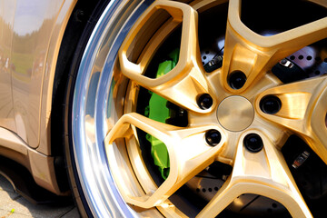 Alloy wheel with calipers and racing brakes of the sport car. Racing brake disc and low profile...