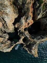 This aerial photo captures the stunning rock formations and turquoise waters at Ponta da Piedade in Lagos, Algarve. 