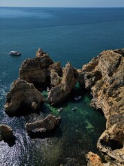 This aerial photo captures the stunning rock formations and turquoise waters at Ponta da Piedade in Lagos, Algarve. 