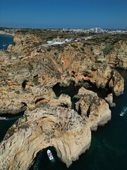 This aerial photo captures the stunning rock formations and turquoise waters at Ponta da Piedade in Lagos, Algarve. 