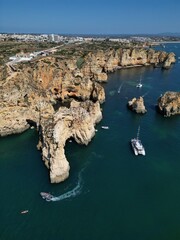 This aerial photo captures the stunning rock formations and turquoise waters at Ponta da Piedade in Lagos, Algarve. 