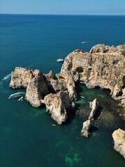 This aerial photo captures the stunning rock formations and turquoise waters at Ponta da Piedade in Lagos, Algarve. 