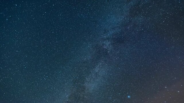 The Milky Way moving across the night sky. Captures the mesmerizing motion of stars and cosmic detail in a clear, dark sky