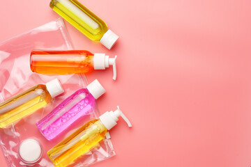 Clear Plastic Bag Containing Travel-Sized Toiletries on Pink Background