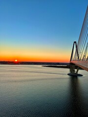 sunset on the bridge over sea