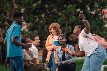 Interracial happy students having fun college campus on a coffee break