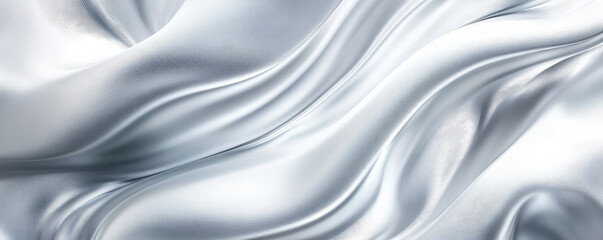 Obraz premium A sophisticated abstract background featuring silky, 3D wave patterns in shades of silver and white. The fabricâ€™s smooth, flowing texture adds a modern, elegant touch.