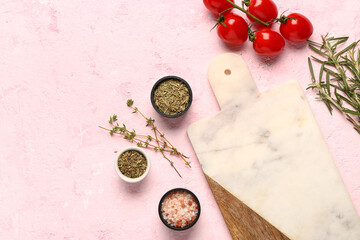 Cutting board, fresh tomatoes and spices on color background