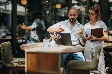 Business workers collaborating in a coffee bar, brainstorming ideas and sharing knowledge for remote work solutions.