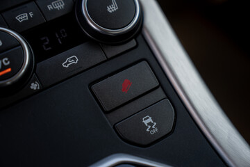 Car traction control buttons on fron panel close up with different symbols for changing settings of...
