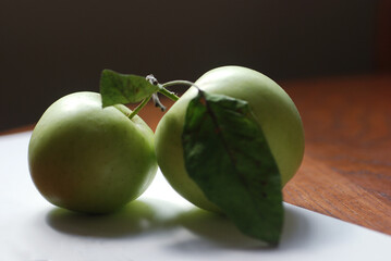 green apples on a wooden table