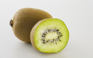 Close-up of kiwi fruit cut on white background, rich in nutrition