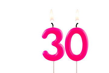 Pink number 30 birthday candle on white background