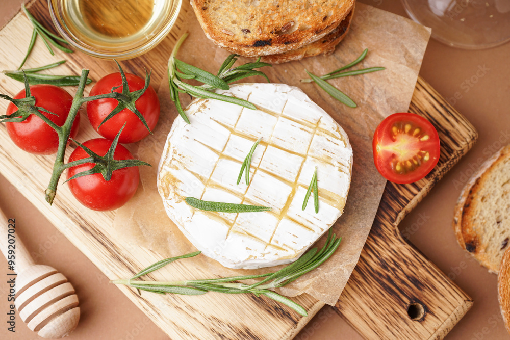 Wall mural Wooden board with tasty baked Camembert cheese on brown background