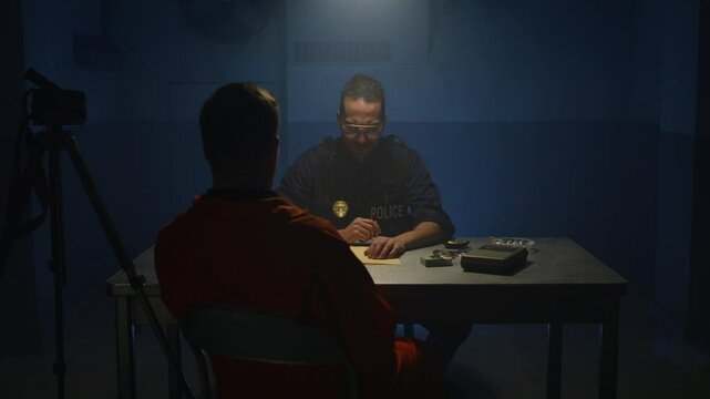 Police interrogation black cop and inmate