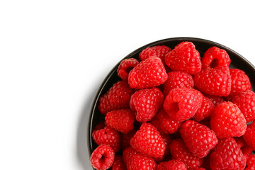 Tray with fresh raspberries on white background