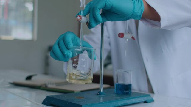 Hands of a laboratory worker carrying out a study