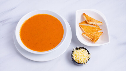 Tomato soup bowl with crackers