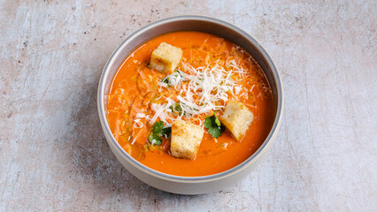 Tomato soup bowl with crackers
