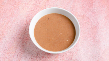 Creamy mushroom soup bowl top view	