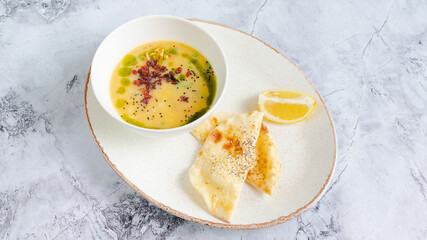 Creamy soup bowl and flatbread