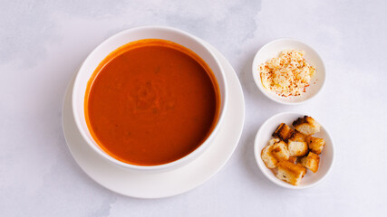 Tomato soup bowl with crackers