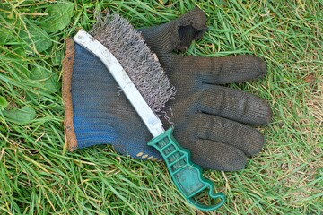 one hand held plastic green handle iron industrial old sharp dangerous brush for cleaning rusty...