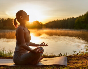 A calming scene of a person practicing deep breathing exercises by a lake at sunrise, with t (17).jpg
