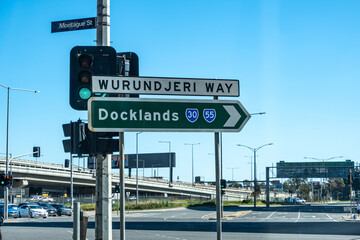 A road sign at an intersection in Melbourne, Australia, indicates the directions to Wurundjeri Way...