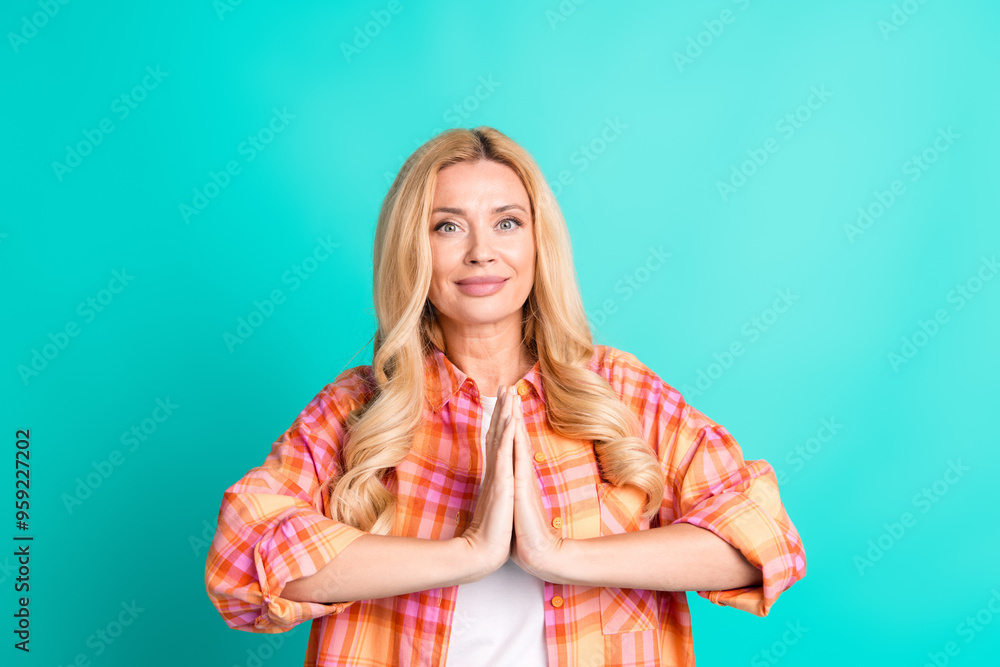 Poster photo portrait of lovely mature lady pray gesture dressed stylish plaid garment isolated on cyan col