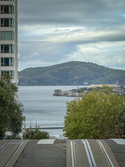 Obraz premium Scenic view of Alcatraz Island seen from Hyde Street, San Francisco, California, USA against cloudy sky