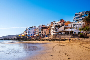 Taghazout, small fishing and surfing village with sandy beach and traditional Moroccan buildings near Agadir, Morocco. Popular seaside resort among surfers