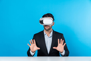 Smart businessman sitting while pointing and choosing data analysis by using technology innovation. Professional caucasian project manager using virtual reality glasses and VR goggles. Deviation.