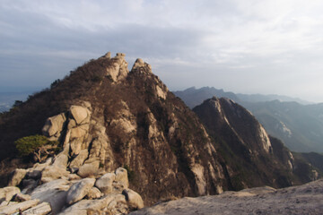 Bukhansan National Park, Seoul, Gyeonggi-do, South Korea, spring landscape view during hike to Baegundae summit peak, process of trekking and climbing to Bukhan mountain, travel and hiking in Korea