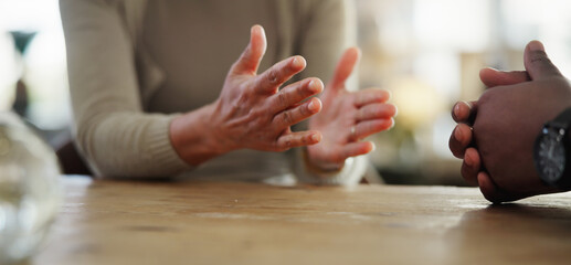 Hands, couple and angry in home, table and argument of people, fighting with accusation and drama. House, calm and miscommunication in relationship, conflict and fight in marriage, divorce or emotion