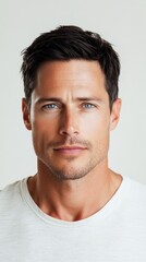 Obraz premium Handsome man with blue eyes posing on white background