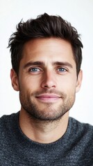 Fototapeta premium Handsome young man smiling and posing on white background