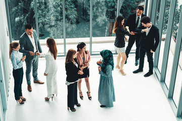 Many business people gathering in modern office building for business conference in the city....