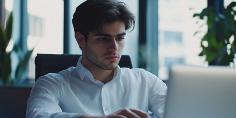 Young Businessman Working on Laptop