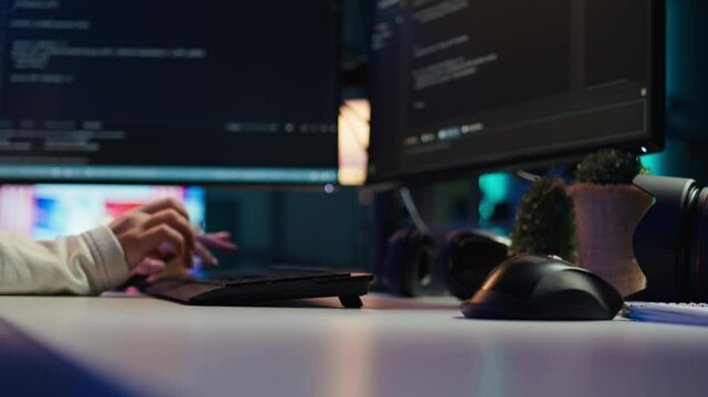 Computer technician working from home, designing and developing software applications, close up. IT specialist typing on PC keyboard, implementing and maintaining company systems, camera B