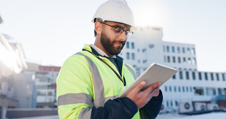 Man, engineer or tablet on rooftop for construction planning, building maintenance or architecture. Contractor, typing or tech for project management in city for infrastructure development feedback