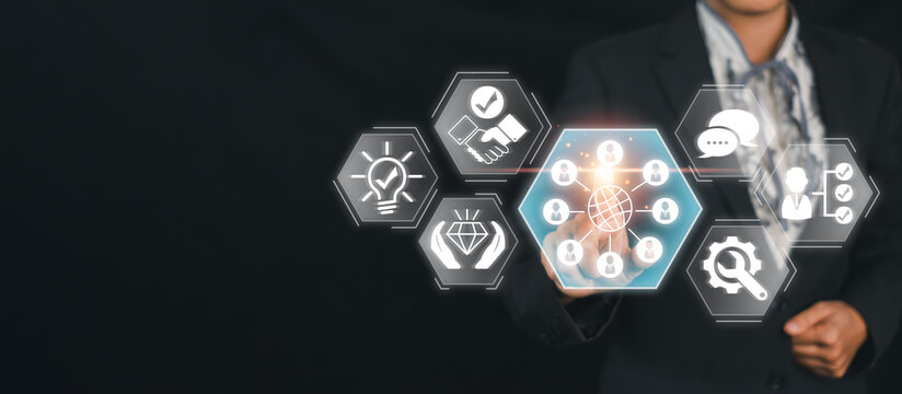 A businessman in a suit interacts with a digital interface showcasing various icons representing global culture and modern technology concepts.