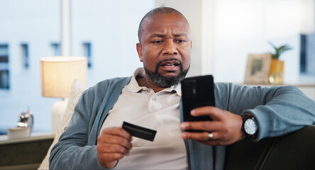 Credit card, scam or black man with phone on website notification in home with stress or crisis. Fear, victim and upset person frustrated by mobile app, hacked pension fund or reading news in Nigeria
