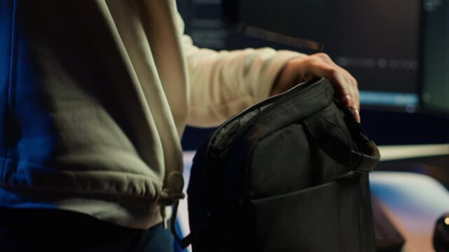 Computer scientist unpacking laptop bag, preparing to design and develop software applications. IT professional starting job shift, opening notebook to do coding, camera A