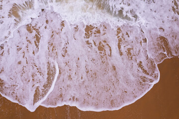 Beautiful sea beach and waves texture in sunny summer day background