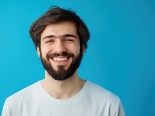 Obraz premium Smiling Man with Beard on Blue Background. Generative AI.