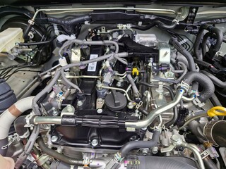 Fototapeta premium Diesel Engine in Car. Close-up of Engine Parts in Engine Room of New Truck. Selective focus